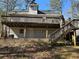 Back exterior with a deck and stairs, perfect for outdoor entertaining and relaxation at 3973 Woodland Se Cir, Conyers, GA 30013