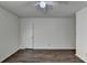 Simple bedroom with wood flooring and ceiling fan at 574 Northridge Crossing Dr, Sandy Springs, GA 30350