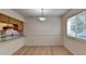 Dining area with light flooring and kitchen view at 574 Northridge Crossing Dr, Sandy Springs, GA 30350