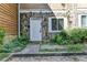 Front door entrance with stone accents at 574 Northridge Crossing Dr, Sandy Springs, GA 30350