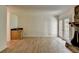 Living room with hardwood floors and stone fireplace at 574 Northridge Crossing Dr, Sandy Springs, GA 30350