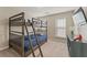 Bedroom featuring bunk beds, plush carpeting, and a neutral color scheme at 702 Berkeley Ter, Canton, GA 30115