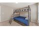 Bedroom featuring bunk beds with ladder and a window allowing natural light at 702 Berkeley Ter, Canton, GA 30115