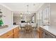 Breakfast nook with wood table and seating next to kitchen at 702 Berkeley Ter, Canton, GA 30115