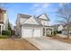 Charming two-story home featuring a two-car garage and welcoming front porch at 702 Berkeley Ter, Canton, GA 30115