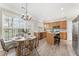 Eat-in kitchen with island, stainless appliances and bright windows at 702 Berkeley Ter, Canton, GA 30115