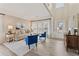 Bright living room featuring hardwood floors, large windows, and stylish furniture at 702 Berkeley Ter, Canton, GA 30115