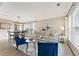 Cozy living area flows into dining space, bathed in natural light from large windows at 702 Berkeley Ter, Canton, GA 30115