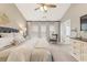 Relaxing main bedroom featuring neutral tones, carpet, ceiling fan, and decor at 702 Berkeley Ter, Canton, GA 30115