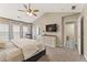 Serene main bedroom with vaulted ceilings, windows with blinds and a door to the main bathroom at 702 Berkeley Ter, Canton, GA 30115