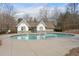 Community pool with clean water and pool-side changing area for outdoor relaxation and recreation at 702 Berkeley Ter, Canton, GA 30115