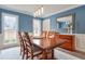 Bright dining room with hardwood floors, large windows, and a wood table at 1776 Chadds Lake Ne Dr, Marietta, GA 30068