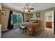 Spacious bedroom with large windows, ceiling fan, and ensuite bathroom at 379 Reynolds Bridge Road, Kingston, GA 30145