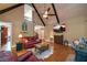 Spacious living room featuring hardwood floors, a cozy fireplace, and large windows at 379 Reynolds Bridge Rd, Kingston, GA 30145