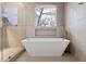 Relaxing bathroom with a freestanding soaking tub and walk-in shower at 1416 Elizabeth Sw Ave, Atlanta, GA 30310