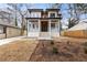Two-story modern home with white siding, dark trim, and a front porch at 1416 Elizabeth Sw Ave, Atlanta, GA 30310