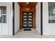 Stylish black double front door with wood accent wall at 1416 Elizabeth Sw Ave, Atlanta, GA 30310