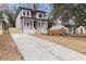 Two-story home with a driveway and landscaped yard at 1416 Elizabeth Sw Ave, Atlanta, GA 30310