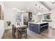 Modern kitchen with large island, white cabinets, and dark blue accents at 1416 Elizabeth Sw Ave, Atlanta, GA 30310