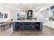 Modern kitchen with a large island, white cabinets and a marble backsplash at 1416 Elizabeth Sw Ave, Atlanta, GA 30310