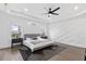Spacious main bedroom with wood floors, large windows, and stylish wall accents at 1416 Elizabeth Sw Ave, Atlanta, GA 30310