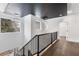 Stunning upper hallway with a modern chandelier and dark wood floors at 1416 Elizabeth Sw Ave, Atlanta, GA 30310