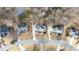Bird's-eye view of the homes in a suburban neighborhood with winding roads and mature trees at 305 Corrigan Trce, Peachtree City, GA 30269