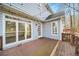 Outdoor lighting enhances this back deck's appeal, perfect for enjoying the outdoors day or night at 305 Corrigan Trce, Peachtree City, GA 30269