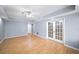 This basement has recessed lighting and a french door leading to the exterior at 305 Corrigan Trce, Peachtree City, GA 30269