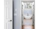 Bright bathroom featuring a modern soaking tub, chandelier, and large window with natural light at 305 Corrigan Trce, Peachtree City, GA 30269
