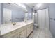 Bathroom with double sinks, shower, and new white cabinets at 305 Corrigan Trce, Peachtree City, GA 30269