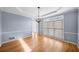 Elegant dining room features a modern chandelier and bright natural light at 305 Corrigan Trce, Peachtree City, GA 30269