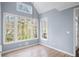 Bright dining room with large windows providing ample natural light and hardwood flooring at 305 Corrigan Trce, Peachtree City, GA 30269