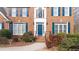 Inviting front entrance with a blue door, detailed molding, and manicured bushes at 305 Corrigan Trce, Peachtree City, GA 30269