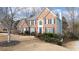 Charming two-story brick home with blue shutters and a well-maintained lawn at 305 Corrigan Trce, Peachtree City, GA 30269
