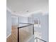 Hallway with wood floors, white banister, and a window above the front door at 305 Corrigan Trce, Peachtree City, GA 30269