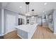 Beautiful kitchen with a huge island, stainless steel appliances, and modern lighting at 305 Corrigan Trce, Peachtree City, GA 30269