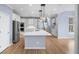 Modern kitchen with a large island, stainless steel appliances, and white cabinetry at 305 Corrigan Trce, Peachtree City, GA 30269