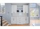 Kitchen featuring custom white cabinetry and stainless steel microwave and views of the stairs at 305 Corrigan Trce, Peachtree City, GA 30269