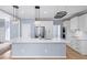 Modern kitchen featuring white cabinets, stainless steel appliances, and a large island at 305 Corrigan Trce, Peachtree City, GA 30269