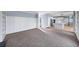 Spacious living room adjacent to the kitchen, with modern paneling and neutral decor at 305 Corrigan Trce, Peachtree City, GA 30269
