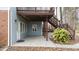 View of covered back patio with stairs leading to upper deck, offering additional outdoor space at 305 Corrigan Trce, Peachtree City, GA 30269