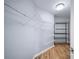 Walk-in closet featuring wire shelving and wood floors at 305 Corrigan Trce, Peachtree City, GA 30269