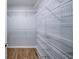 Walk-in closet featuring wire shelving and wood floors at 305 Corrigan Trce, Peachtree City, GA 30269