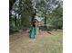 Large wooden playset with swings and climbing wall in backyard at 3499 New Macland Rd, Powder Springs, GA 30127