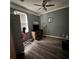 Bedroom with ceiling fan, window and dresser at 3499 New Macland Rd, Powder Springs, GA 30127