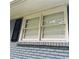 Exterior view of a double-hung window with shutters at 3499 New Macland Rd, Powder Springs, GA 30127