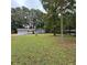 Ranch home with large front yard and mature trees at 3499 New Macland Rd, Powder Springs, GA 30127