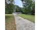 Ranch home with long driveway and mature trees at 3499 New Macland Rd, Powder Springs, GA 30127