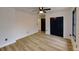 Light-filled bedroom featuring hardwood floors and a ceiling fan at 684 Tarkington Rd, Stone Mountain, GA 30088